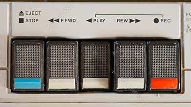 Pressing Play Button on a Retro Cassette Player