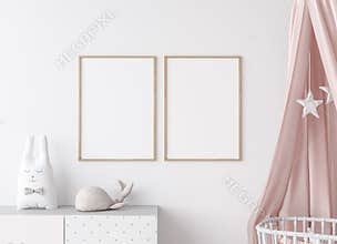 Close up for mock up wooden frame in Scandinavian kids bedroom with white wooden crib for newborn baby.