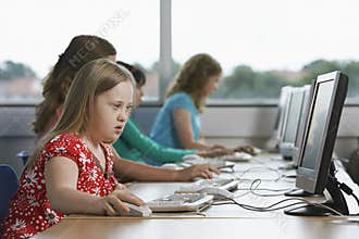 Children (10-12) using computer in computer lab
