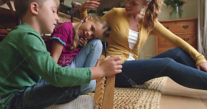 Mother teaching her children mathematics on abacus at home 4k