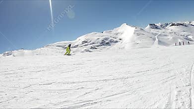 Female skier go down on ski route
