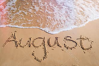 August written on beach