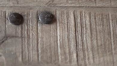 Background close-up of a wood texture with bolts
