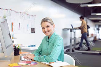 Female graphic designer working on computer