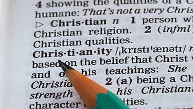 Christianity word definition written in dictionary, one of main religions, faith
