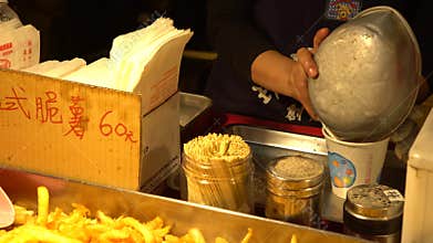 4K of a popular french-fried food at street asia night market in Taipei