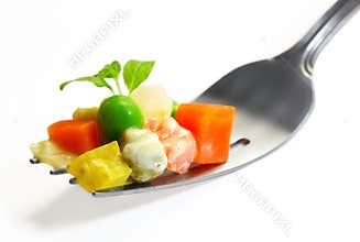 Vegetables mix on fork