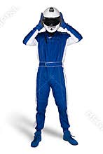 Race driver in blue white motorsport overall shoes gloves and safety gear take off crash helmet after finish isolated white