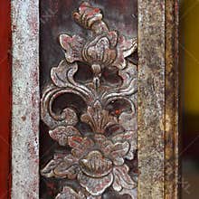 Carved wooden decoration on building of the Citadel, Imperial City Hue, Vietnam.