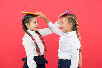 Break is time for fun. Cute small children holding books. Adorable little girls with school exercise books. Preparing