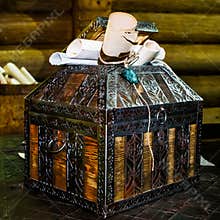 Ancient chest with old documents on table