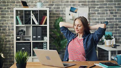 Beautiful young woman using laptop in office then resting thinking smiling