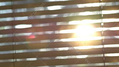 Abstract blurred sunlight goes through the window blinds.