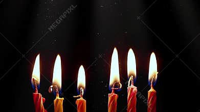 Birthday candles burning on dark background. Celebration party and anniversary concept.