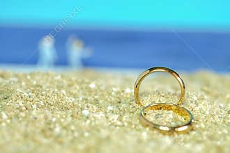 Duo old wedding ring on sea beach ,wedding