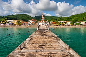 Petite Anse d`Arlet village, with Saint Henri Church and pontoon, in Martinique
