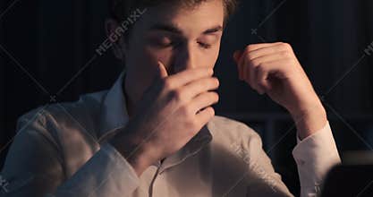 Stressed businessman working late night in office