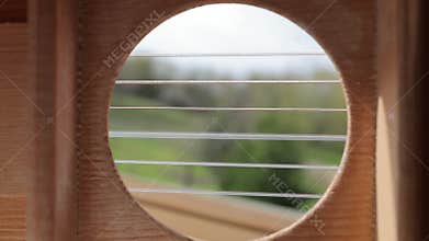 Playing acoustic guitar, slow motion