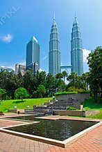 Petronas Towers surrounded by tropical and rain forest