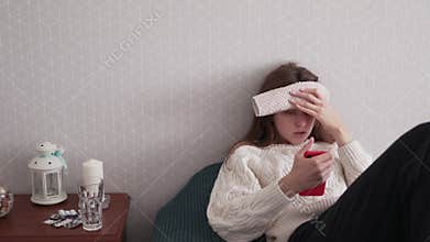 A young woman describes the symptoms of a disease to a doctor using telemedicine on a smartphone. Video call with a