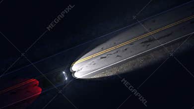 Drone view of car driving on a night country road with headlights, seamless loop