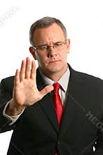 Businessman in gesturing for someone to stop