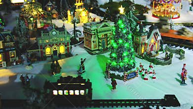 Miniature christmas tree town village with trains tram cable car wagon