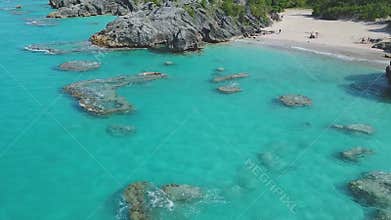 Beach and clear water of the Caribbean. Reefs and the ocean aerial view.