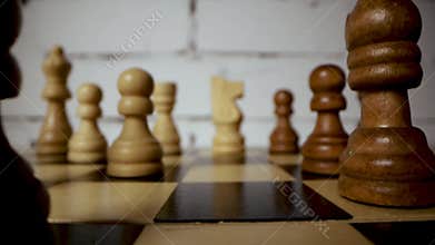 wooden chess pieces on chessboard