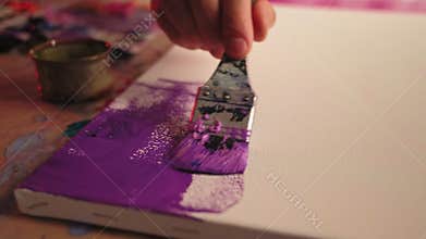 Art therapy male hand creating picture paint