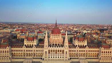 Budapest, Hungary - 4K flying over the Parliament of Hungary at sunset skyline of Budapest