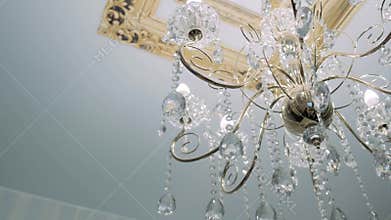 Crystal-powered chandelier hanging on the ceiling