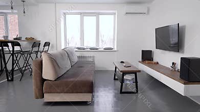 Cozy living room with minimalistic scandinavian interior with grey and white colors