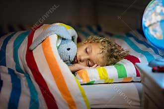 Child sleeping at night. Kids sleep