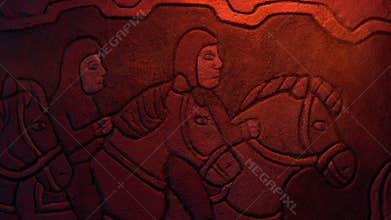 Men On Horseback Ancient Stone Carving In Fire Light