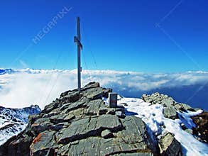 Alpine peak Falknis in the Ratikon border mountain massif or Raetikon Grenzmassiv and over the river Rhine valley Rheintal