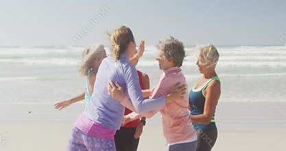 Athletic women having fun on the beach