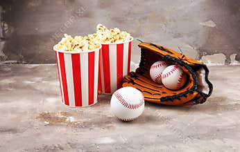 Popcorn on the table with draft beer. Baseball party food with balls for the playoffs