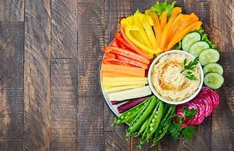 Hummus platter with assorted vegetable snacks. Healthy vegan and vegetarian food.