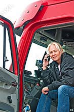 Pretty woman truck driver on phone