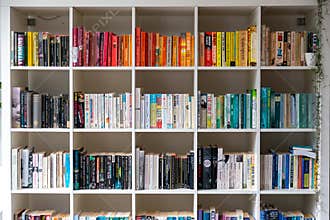 White wooden bookcase filled with books in a UK home