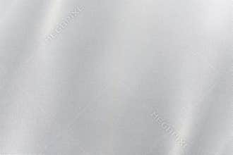 Silver foil glitter metal wall with glowing shiny light, abstract texture background
