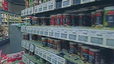 Bonn, Germany - 14 of Dec., 2019: interior shot of REWE supermarket in Bonn POV view. Shelves with seasonings. Lots of