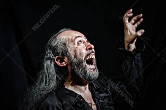 An old actor during a theatrical performance