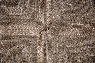 Knitted rope texture with ornament. Background for web design