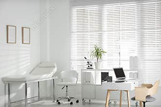 Doctor`s office interior with workplace in clinic
