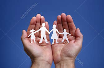 Paper chain family protected in cupped hands