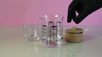 Adding xanthan gum powder to water. Mixture of water and food additive E415. Natural thickener. Texture improver