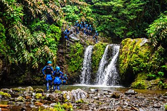 People practicing canyoning in the Natural Park of Ribeira dos Caldeiroes in Azores