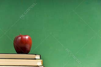 School books and chalkboard